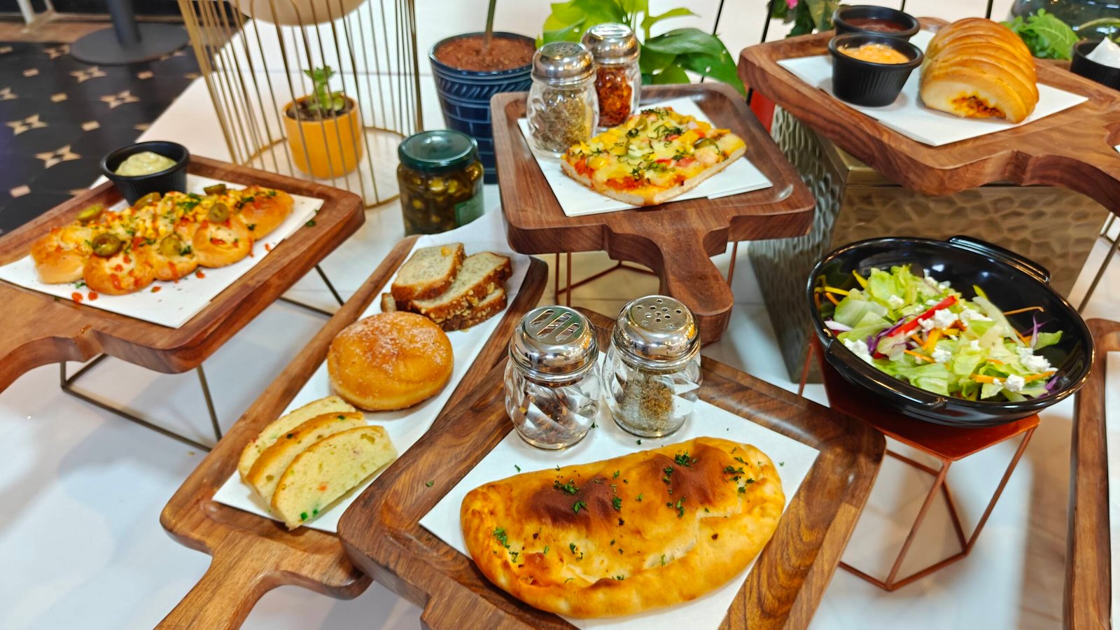 Plated wedding spread presented on wooden risers
